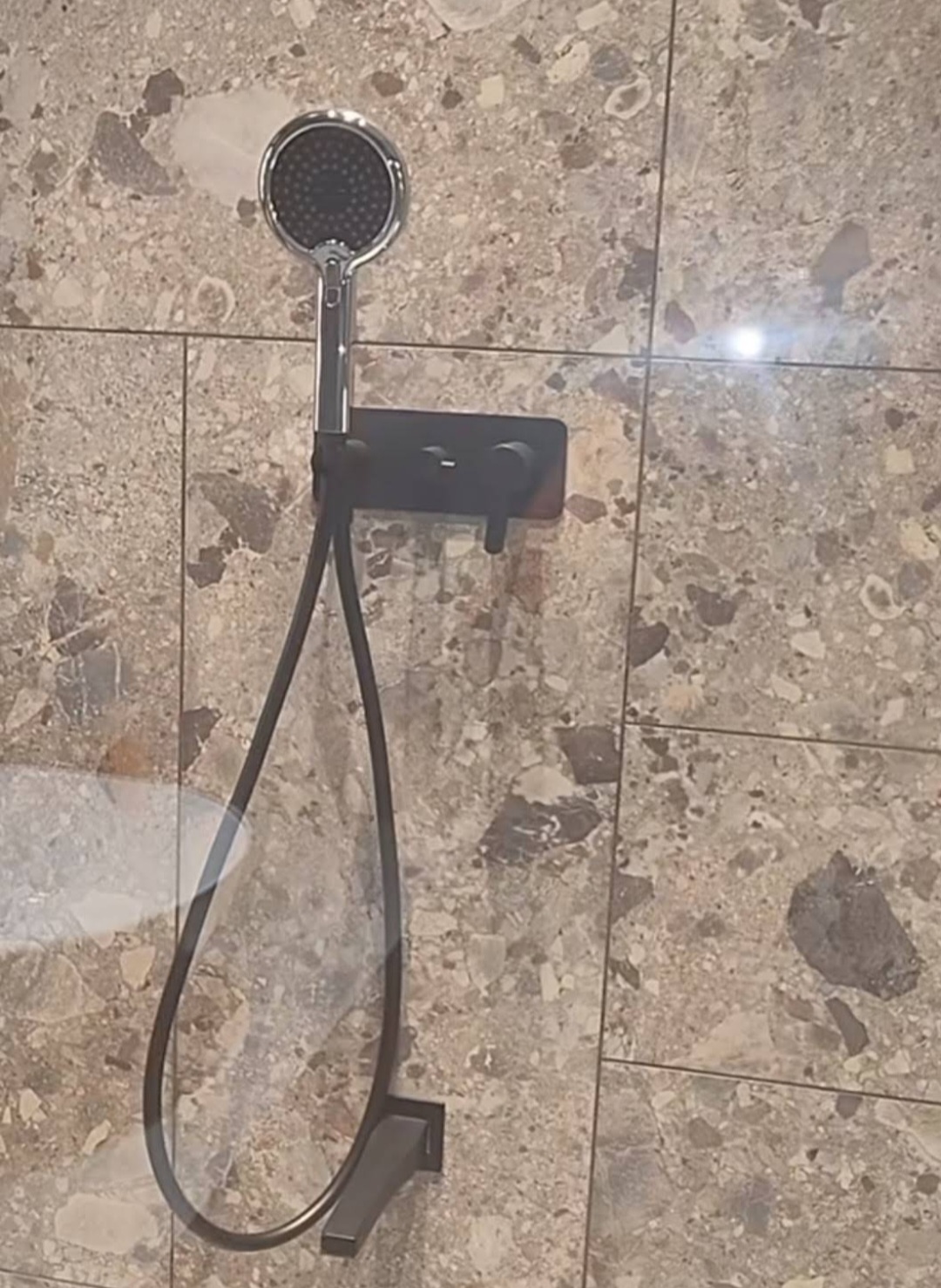 Modern shower system with marble stone tiles